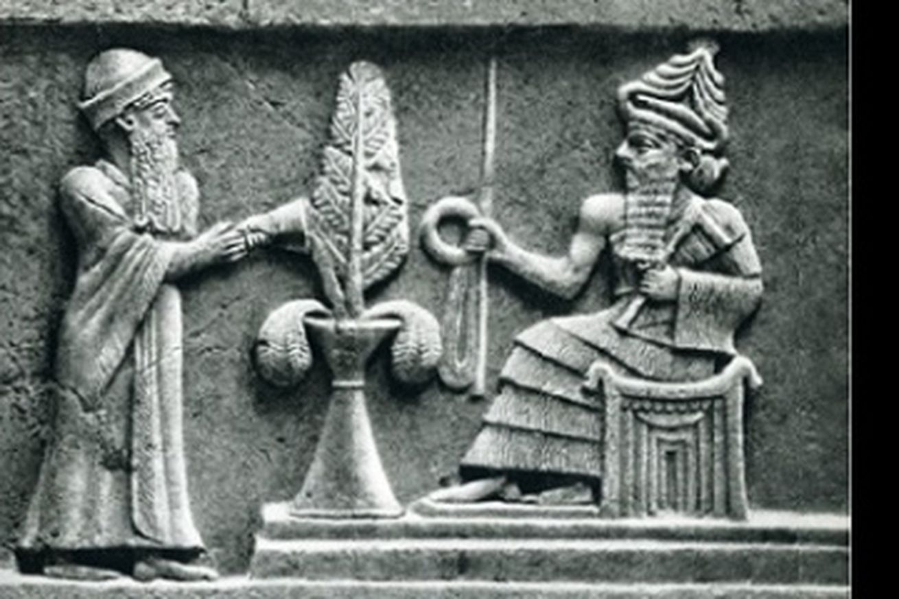 a stone relief of the ancient Babylonian god Enlil sitting on a throne