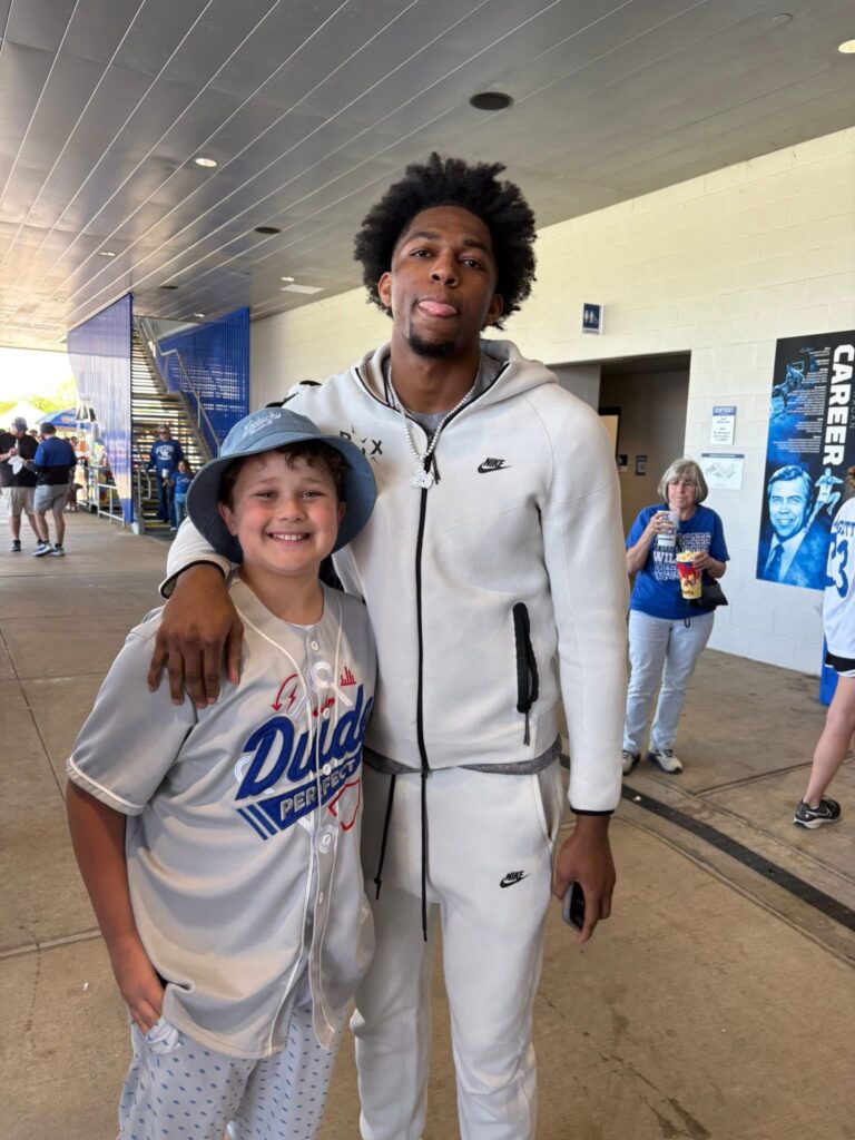 Kentucky forward Mo Dioubate poses with a fan (Photo via Adam Hawkins/Facebook)