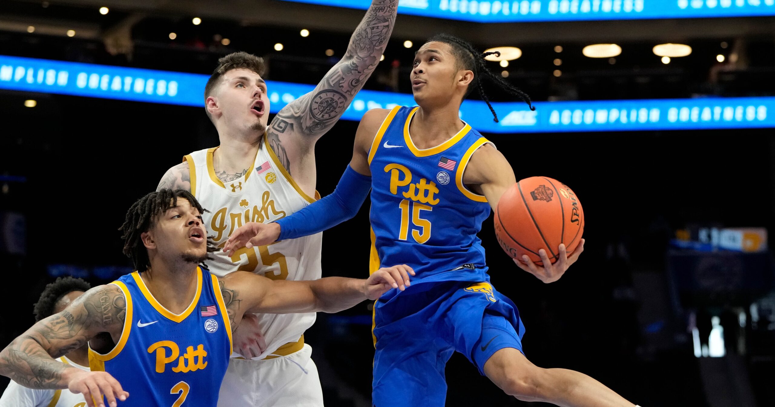 Mar 11, 2025; Charlotte, NC, USA; Pittsburgh Panthers guard Jaland Lowe (15) shoots as Notre Dame Fighting Irish forward Nikita Konstantynovskyi (25) defends in the second half at Spectrum Center. Mandatory Credit: Bob Donnan-Imagn Images