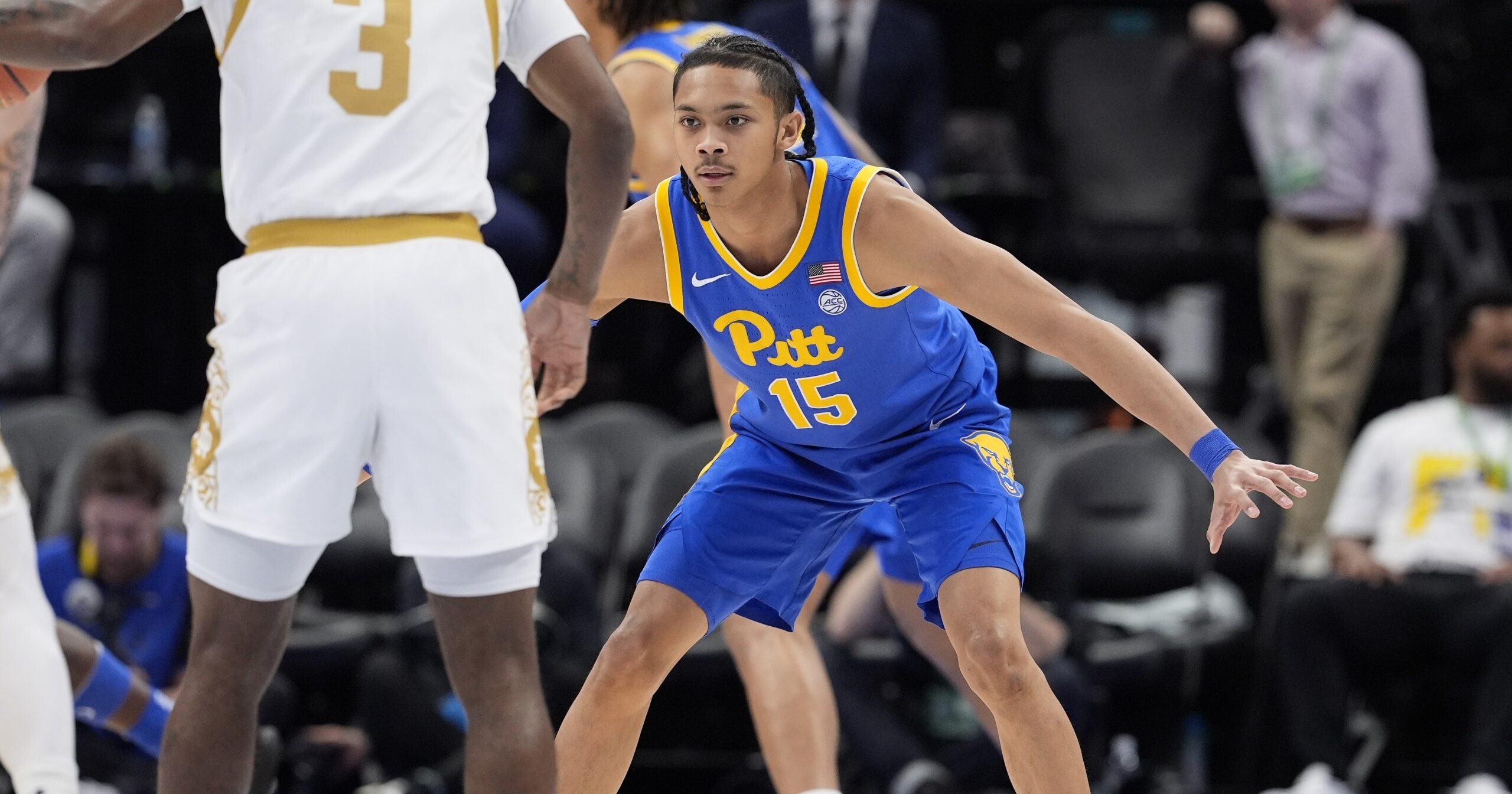 Mar 11, 2025; Charlotte, NC, USA; Pittsburgh Panthers guard Jaland Lowe (15) back on defense against Notre Dame Fighting Irish guard Markus Burton (3) during the first half at Spectrum Center. Mandatory Credit: Jim Dedmon-Imagn Images