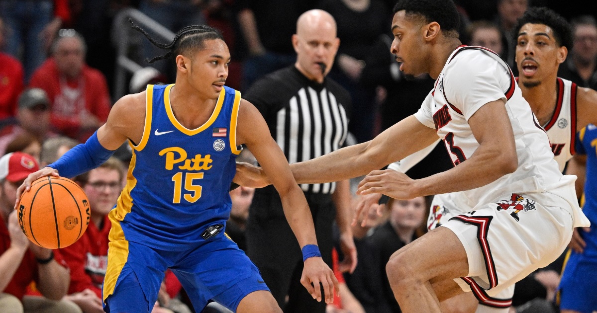 Mar 1, 2025; Louisville, Kentucky, USA; Pittsburgh Panthers guard Jaland Lowe (15) dribbles against Louisville Cardinals center Frank Anselem-Ibe (13) during the second half at KFC Yum! Center. Louisville defeated Pittsburgh 79-68. Mandatory Credit: Jamie Rhodes-Imagn Images

