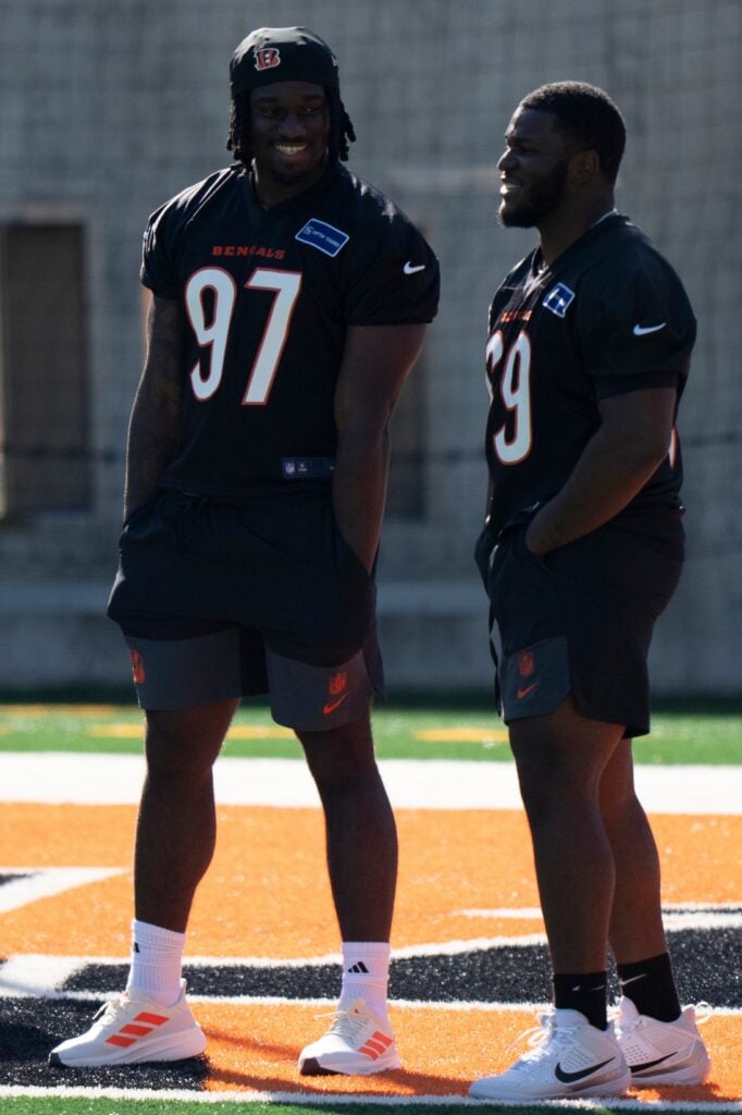 Bengals defensive end Shemar Stewart, left, smiles with Bengals defensive tackle Dante Barnett during the Bengals Rookie Mini Camp on Friday, May 9, 2025 at Paycor Stadium in Cincinnati.