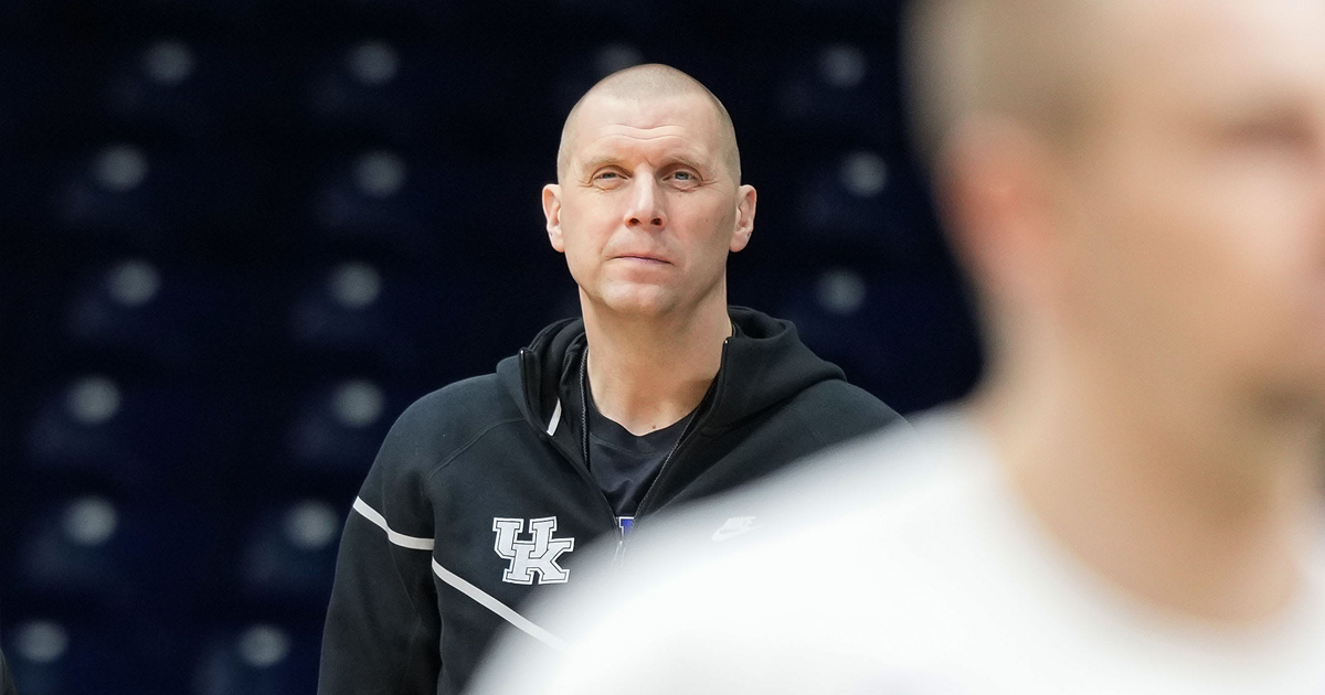 Kentucky Wildcats head coach Mark Pope watches players shoot around Thursday, March 27, 2025, during practice ahead of the Sweet Sixteen March Madness tournament game against the Tennessee Volunteers at Lucas Oil Stadium in Indianapolis.