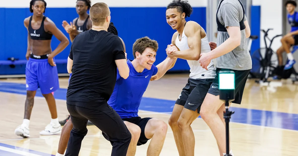 Jaland Lowe helps up Trent Noah | Eddie Justice, UK Athletics