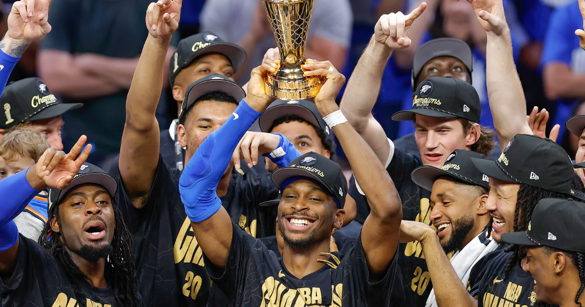 Jun 22, 2025; Oklahoma City, Oklahoma, USA; Oklahoma City Thunder guard Shai Gilgeous-Alexander (2) holds up his NBA Finals Bill Russell MVP trophy at the end of game seven of the 2025 NBA Finals after defeating the Indiana Pacers at Paycom Center. Mandatory Credit: Alonzo Adams-Imagn Images