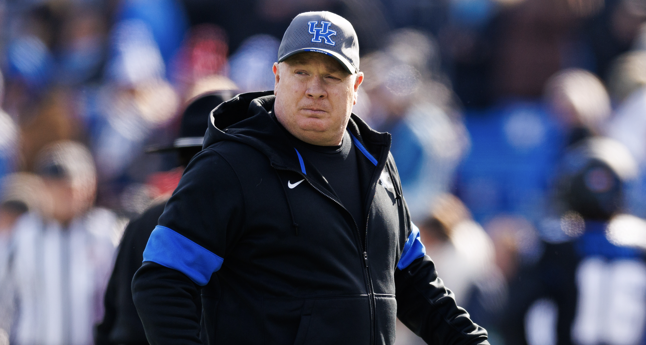 Nov 30, 2024; Lexington, Kentucky, USA; Kentucky Wildcats head coach Mark Stoops walks onto the field before the game against the Louisville Cardinals at Kroger Field. Mandatory Credit: Jordan Prather-Imagn Images